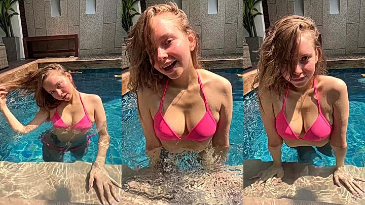 Baby Riley teasing her bikini tits in the pool