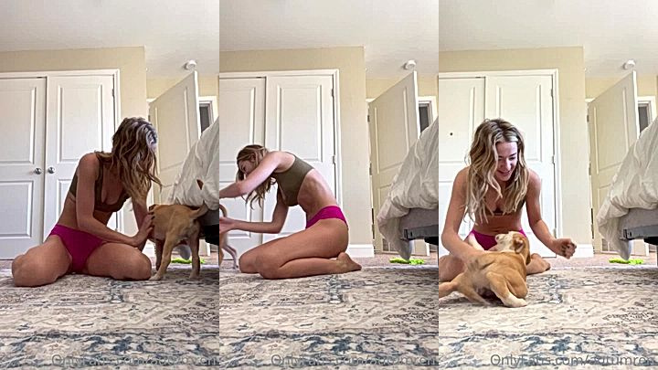 Autumren playing with her dog in her sexy gym outfit