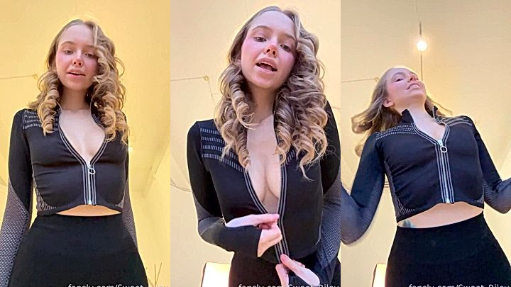 sexy girl Baby Riley unzipping her perky tits for her fans