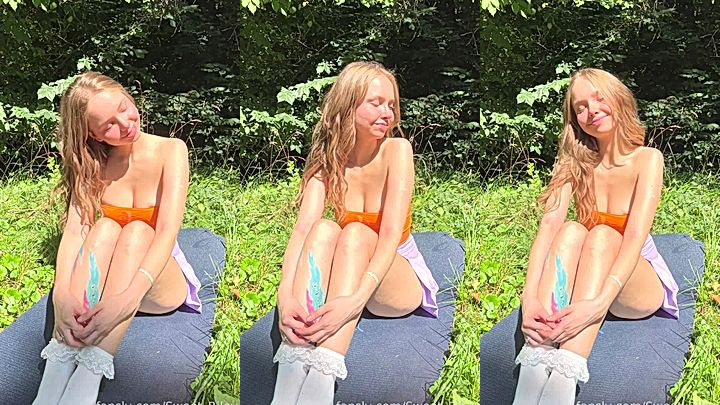 teen beauty Baby Riley enjoying the sun in the park