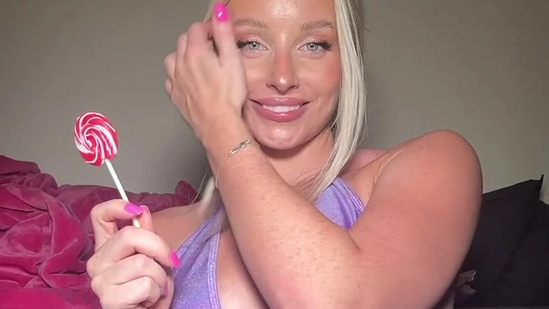 sexy blonde bombshell Charlotte Parkes sucking on a lolipop