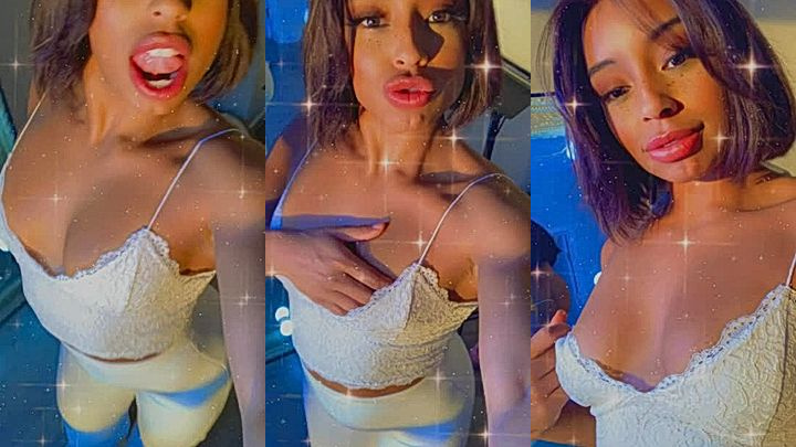 ebony chick Qimmah Russo teasing her perky tits for the fans