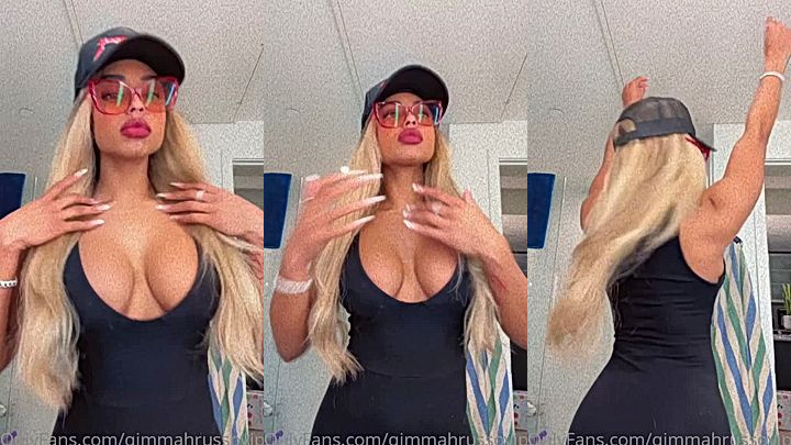 ebony supermodel Qimmah Russo showing off her lowcut dress