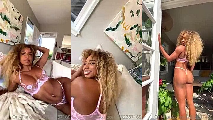 ebon supermodel girl Qimmah Russo showing off her perfect ass on the couch