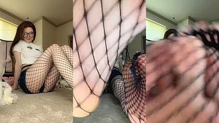glasses girl Strawbeariemilkk teasing her fishnet stockings and cute toes