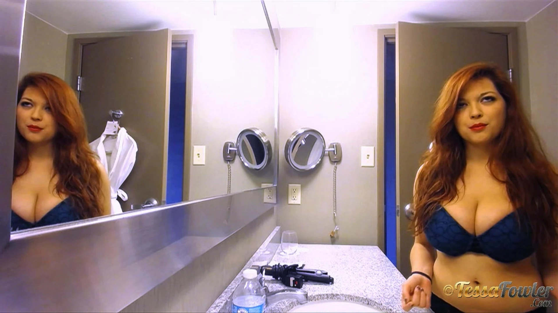 Tessa Fowler teasing her big tits in the bathroom mirror