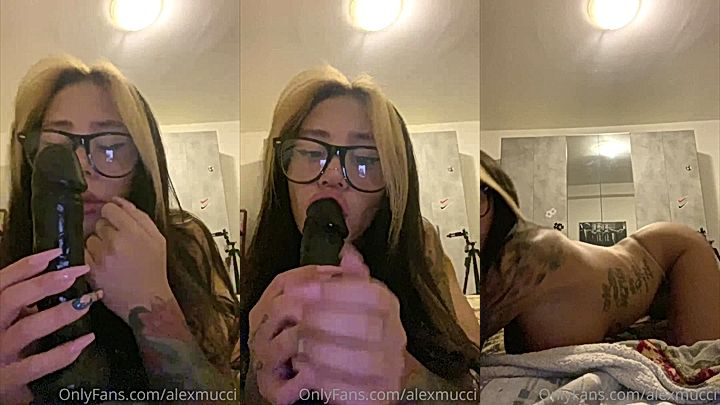 Alex Mucci sucking on a black dildo and big booty shaking
