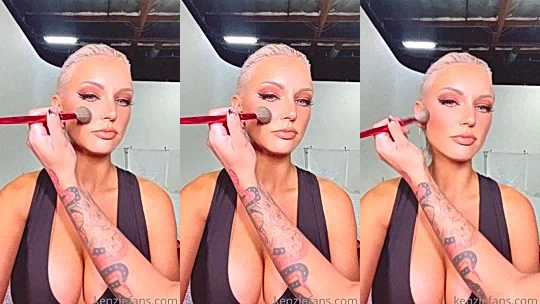 blonde supermodel Kenzie Taylor teasing her deep cleavage during makedup