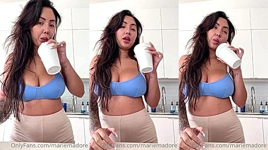 Marie Madore teasing her big tits in her blue bra while having lunch