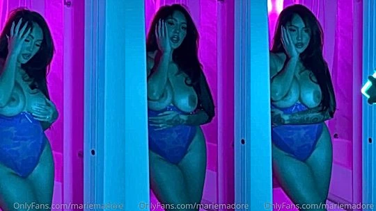 Marie Madore teasing her naked big tits in her purple bodysuit