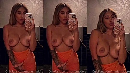 Marie Madore flashing her big natural tits in her pink dress