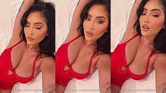 Marie Madoreteasing her naked big tits in her red bodysuit