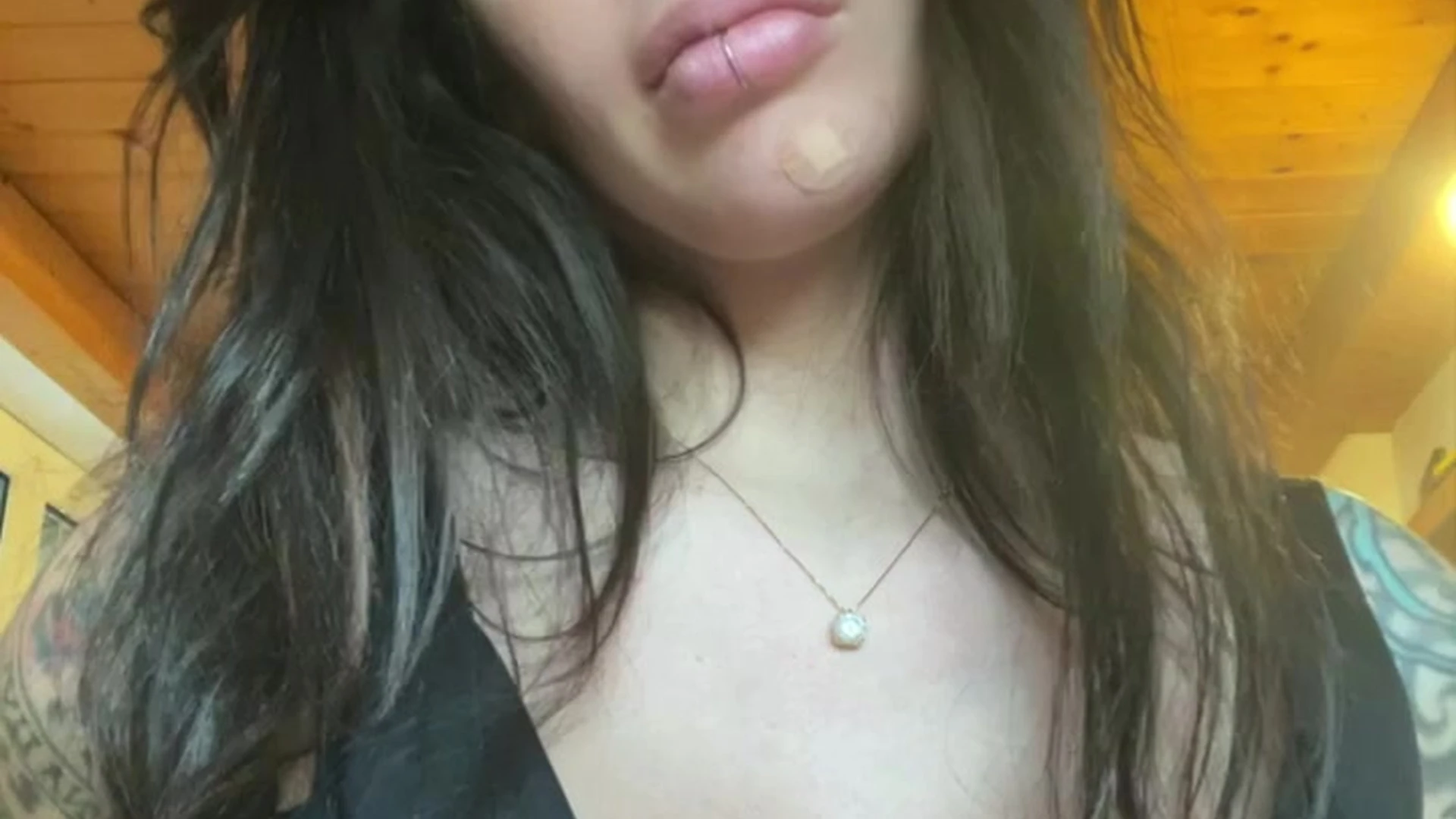 Alex Mucci pulling down her top and teasing her big tits