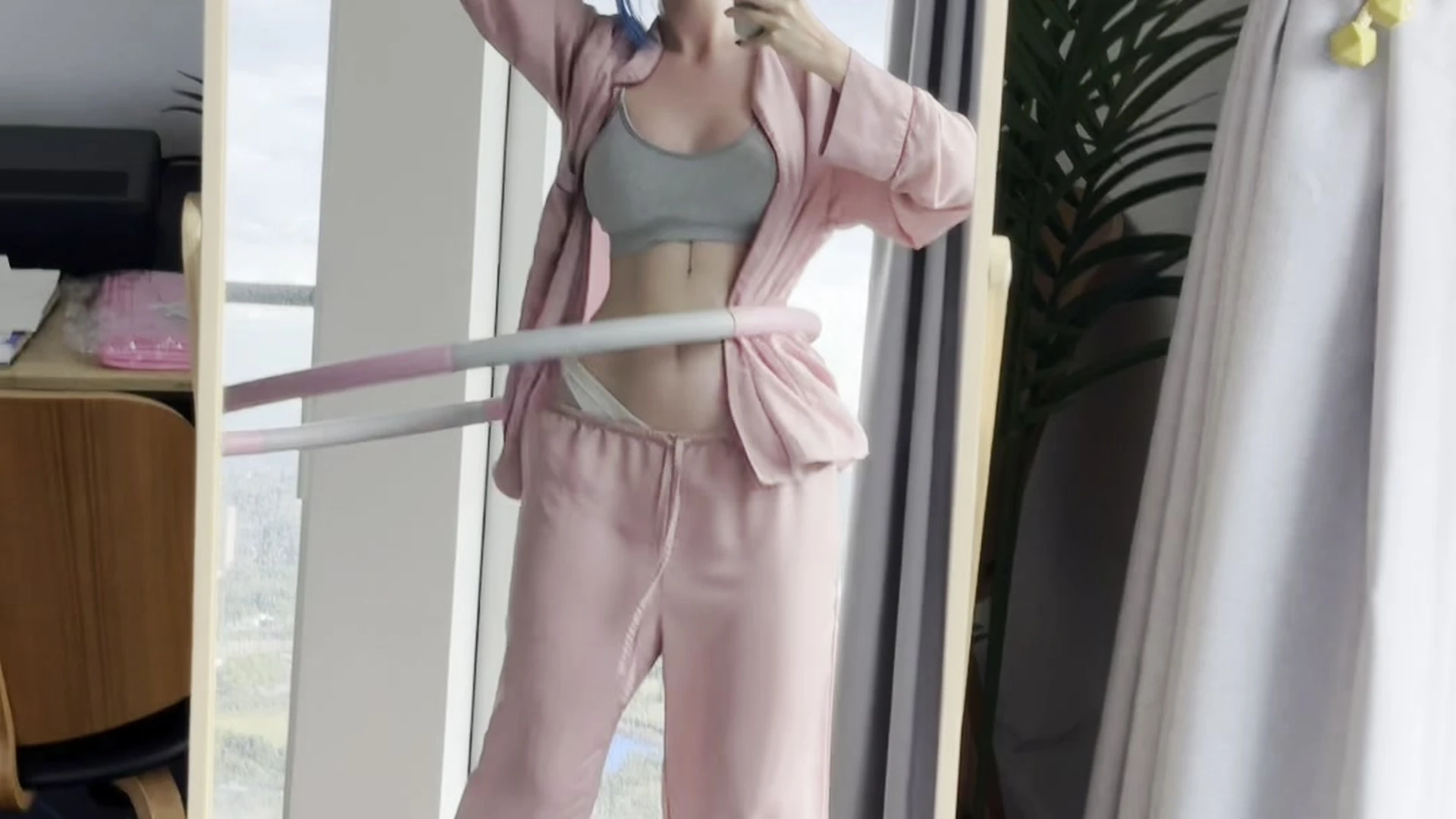Vixenp playing hoola-hoop in her sexy outfit