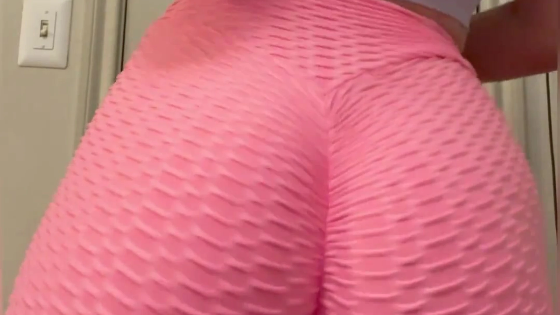 Cutefruit18 pulling down her yoga pants and spanking that big ass