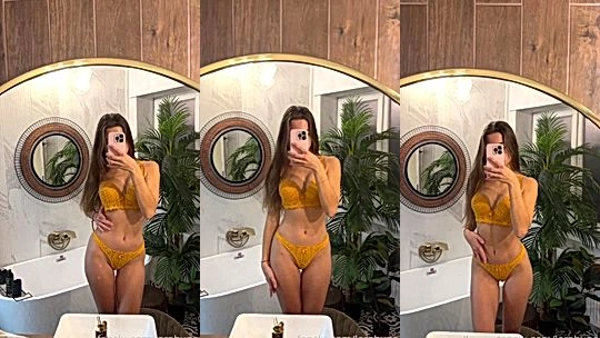 Lerabuns teasing her yellow lingerie in the mirror