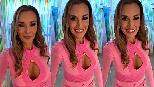 Tania Bann teasing her big tits in her pink dress