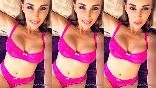 Tanya Tate teasing her big tits in her pink lingerie