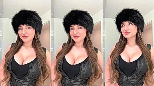 Elizabeth Zaks showing off her deep cleavage