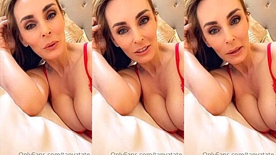 Tanya Tate teaing her big tits in bed