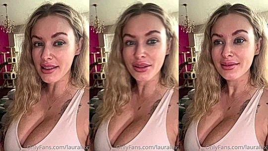 Laura Lux teasing her big tits in her low-cut top