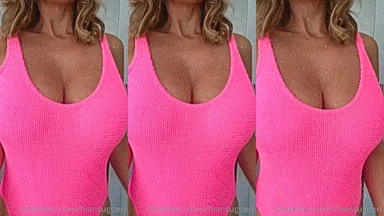 Rhian Sugden teasing her nipples in her pink bodysuit