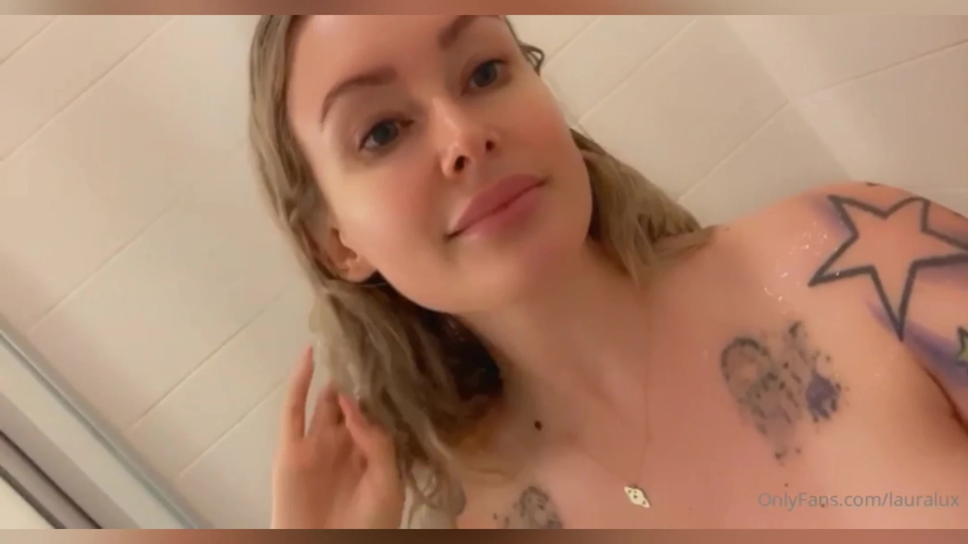 Laura Lux teasing her naked wet pussy in the shower