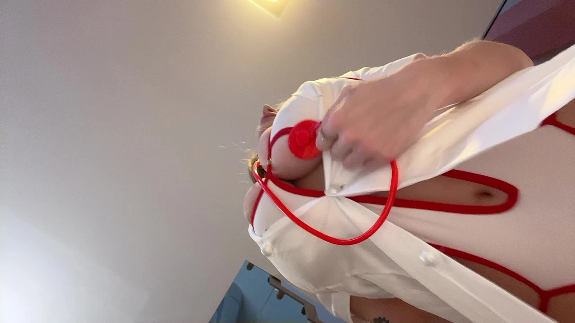 sexy nurse Katerina Soria teasing her big tits