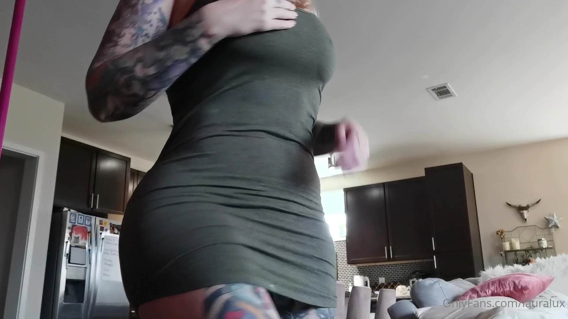 Laura Lux showing off her thicc body in her dress