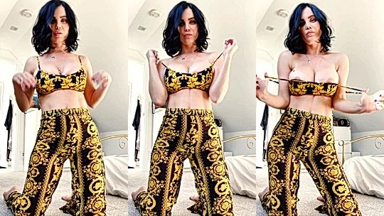 Emma Glover teasing her sexy body in her golden outfit