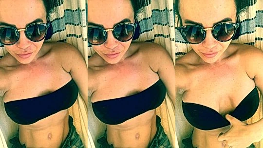 Emma Glover teasing her perky tits in the hammock