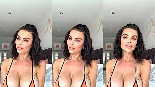 Emma Glover teasing her perky tits in her orange bikini