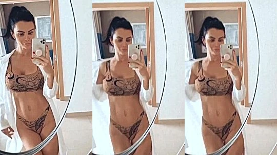 Emma Glover teasing her sexy body in the bathroom mirror