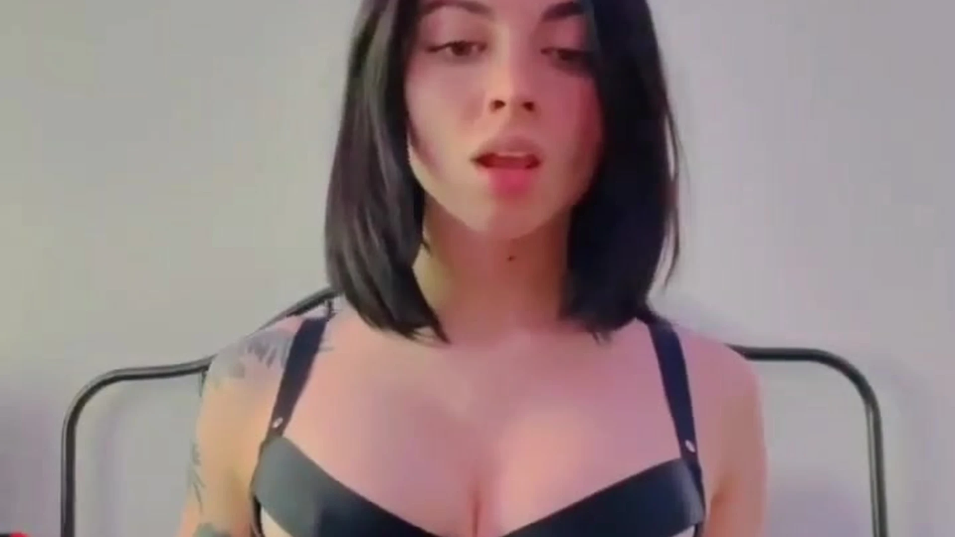 Noemiexlili teasing her big tits in strappy lingerie