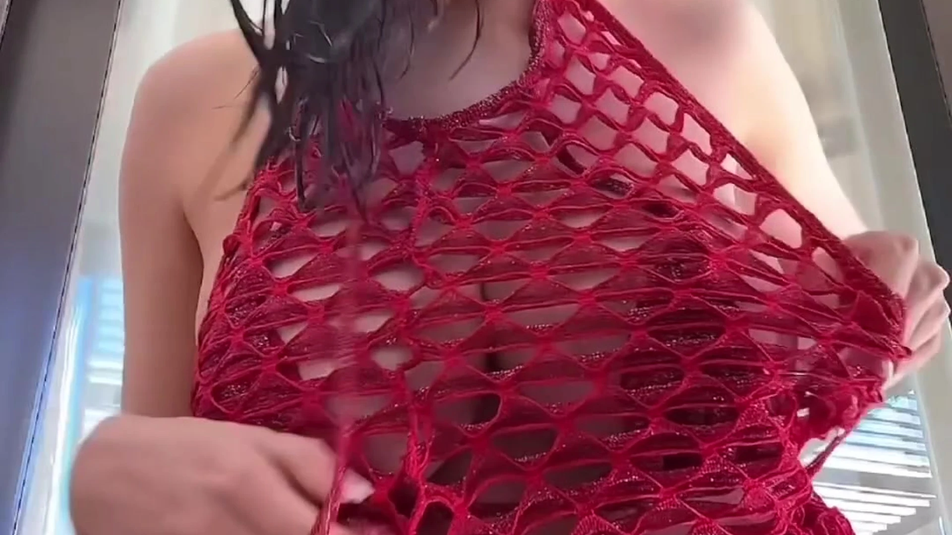 Paige Woolen playing with her big boobies in red fishnet bodysuit