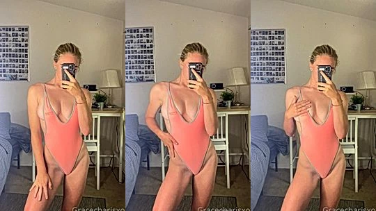 Grace Charis teasing her perky tits in pink bodysuit