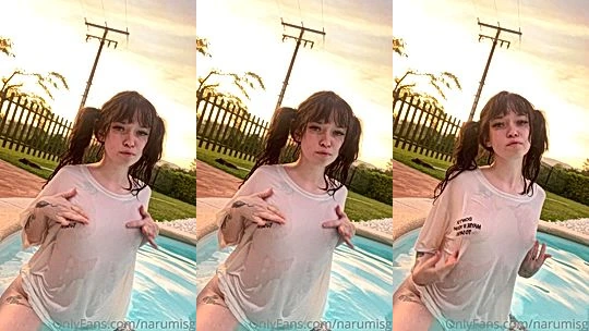 Mia Yokai teasing her wet t-shirt in the pool