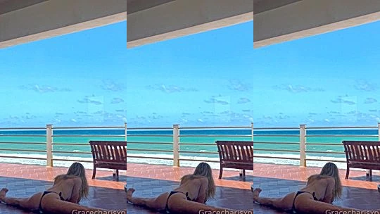 Grace Charis doing split in her bikini by the beach