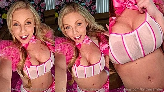 Britney Amber teasing her big tits in white see-through bra