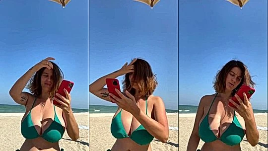 Mady Gio teasing her big tits in her green bikini on the beach