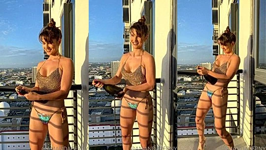 Amanda Cerny teasing her sexy naked body on the balcony