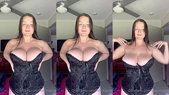 Dakota Jade teasing her naked big tits in black corset