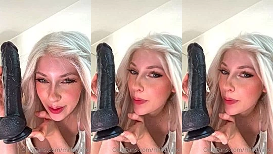 Milkimind teasing her huge black dildo