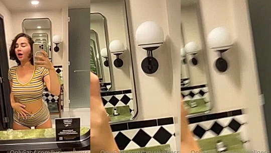 LupuWellness teasing her big booty in the public restroom