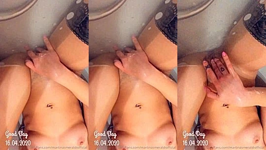 Martina Smeraldi playing with her naked pussy in the bathtub