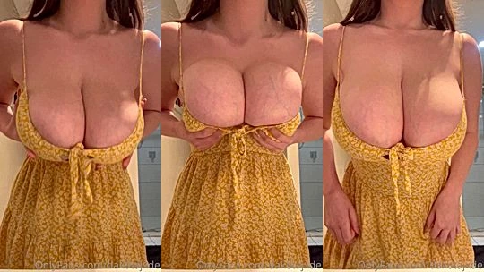 Dakota Jade teasing her big tits in yellow dress