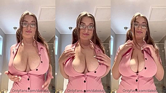 Dakota Jade teasing her big tits in her tight pink dress