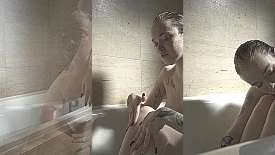 Mia Yokai teasing her wet naked body in the bathtub