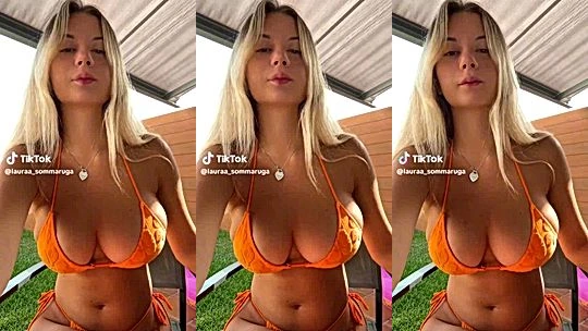Laura Sommaruga shaking her big tits in her orange bikini