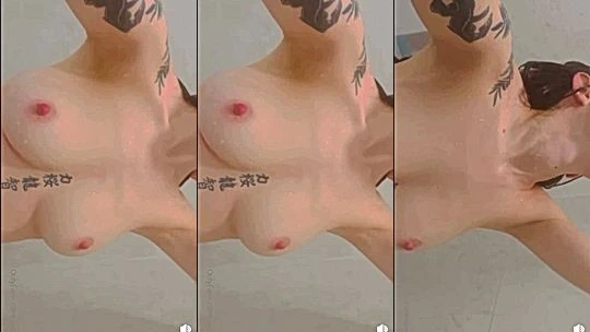 Noemiexlili teasing her wet naked big tits in the shower